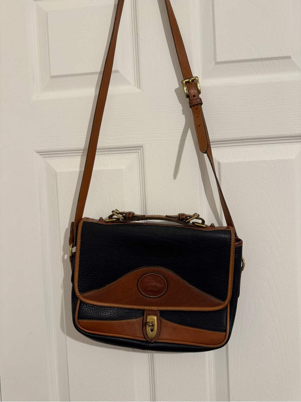 Dooney & Bourke Black with Brown Trim Leather Handbag